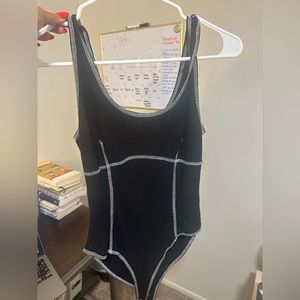 Forever 21 black with white stitching body suit! Size medium